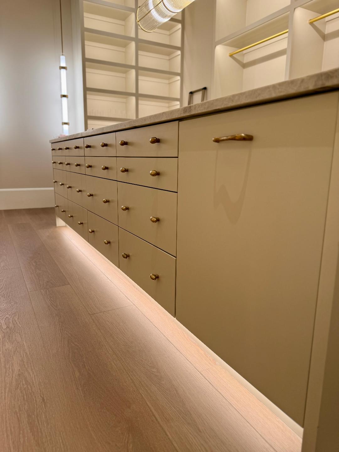 Custom cabinetry with finished lighting