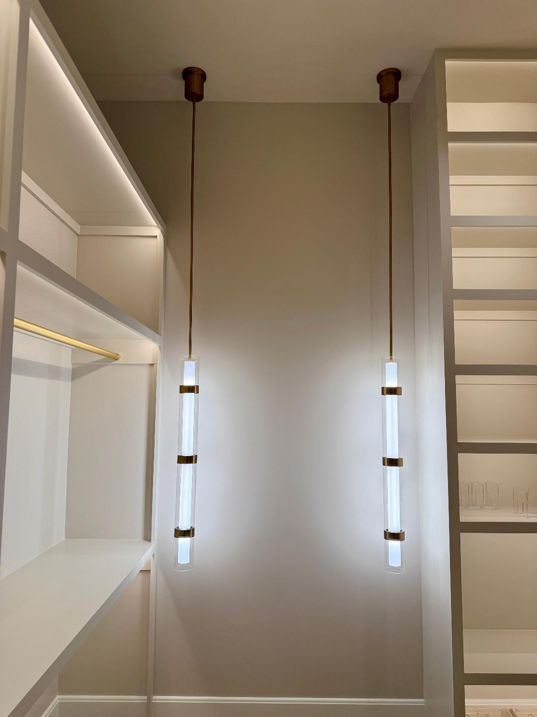 Finished hallway with wall sconces