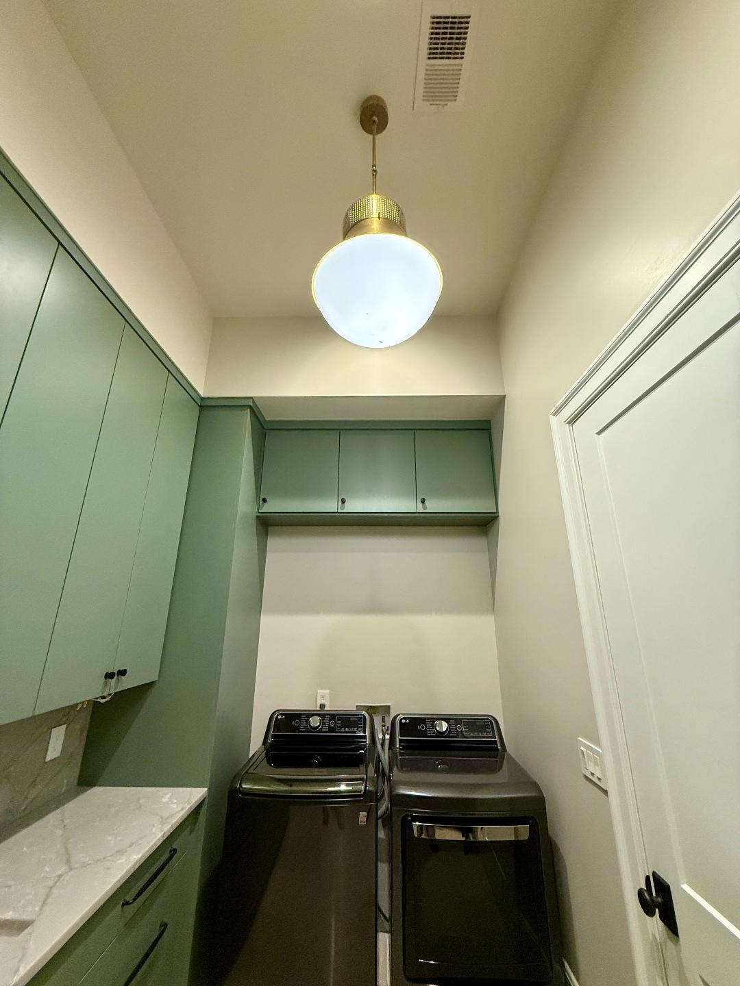 Finished kitchen cabinetry and lighting
